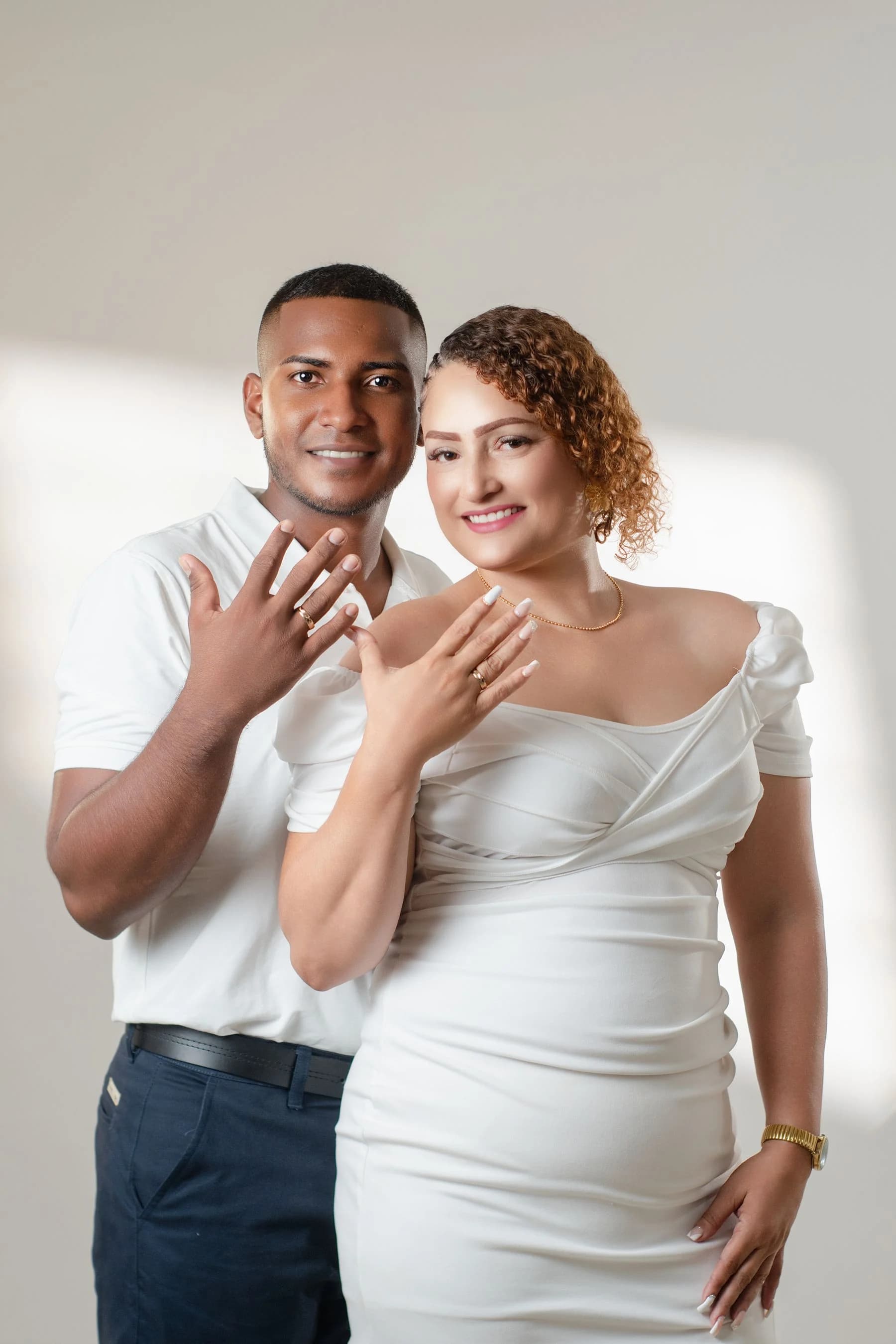 Couple celebrating an engagement in an indoor portrait session
